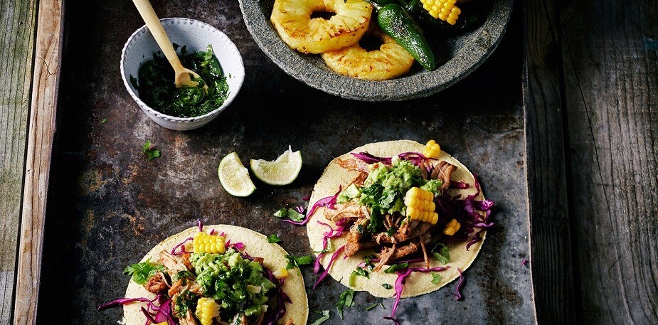Mexican tacos on a black plate Mexican tacos on a black plate